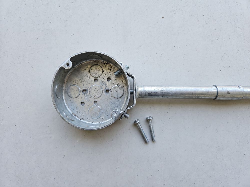 A round fan-rated ceiling box on its brace bar